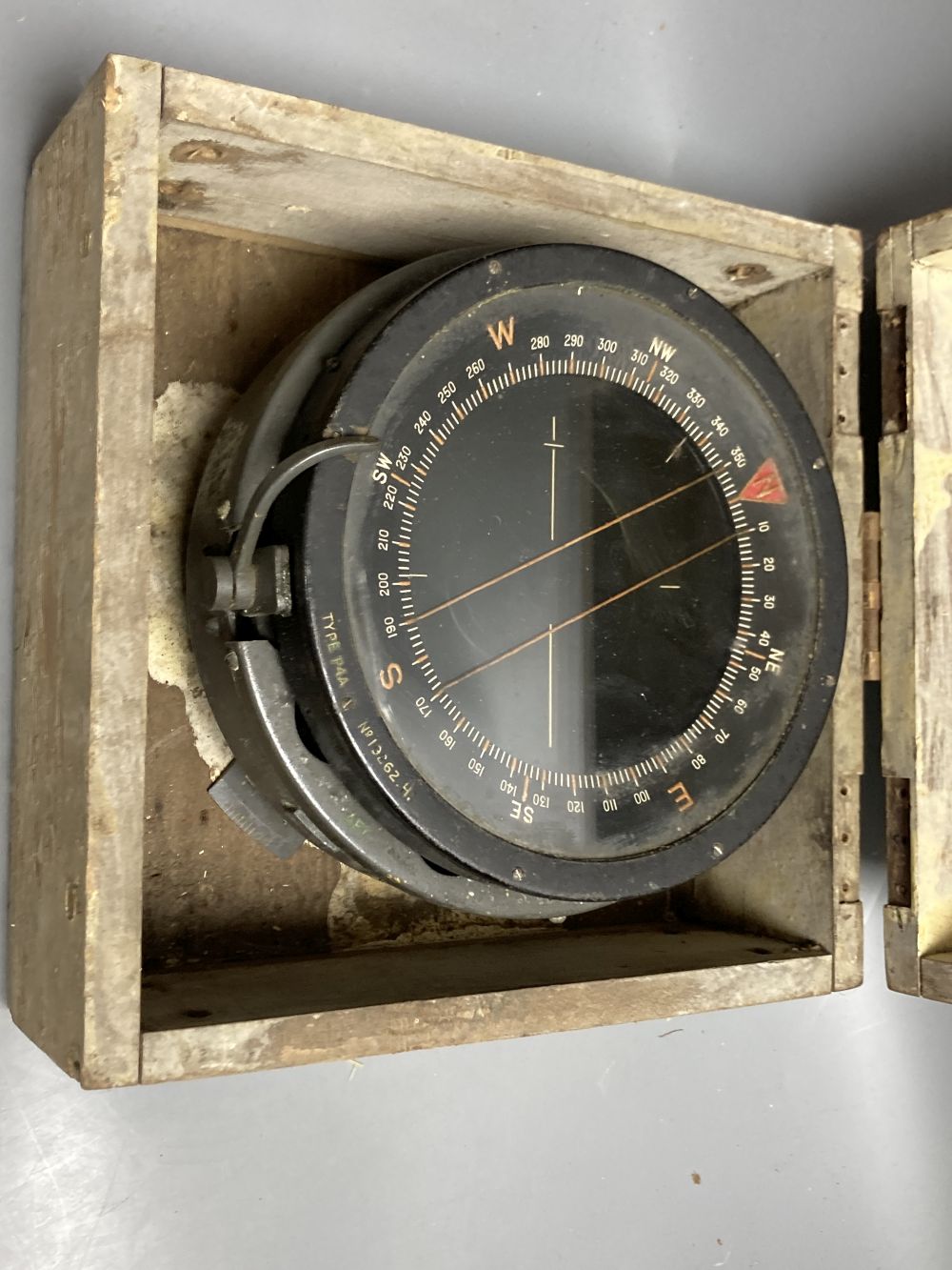 An Air Ministry Astro compass MkII, a similar compass, both cased, a Hydrographic Office Star Identifier and spare Azimuth circle compa